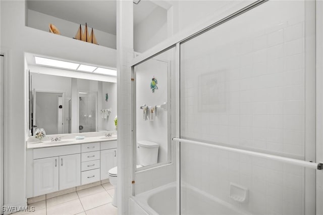 full bathroom with vanity, tile patterned flooring, enclosed tub / shower combo, and toilet