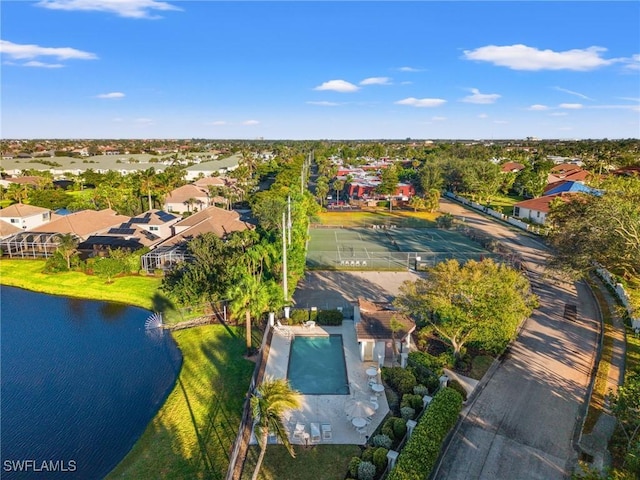 birds eye view of property with a water view