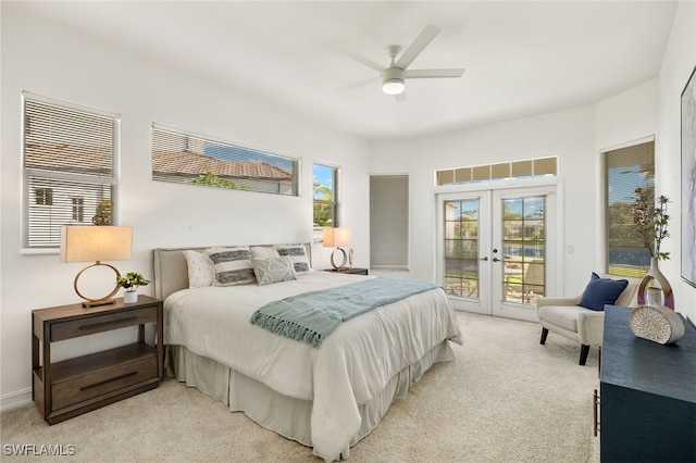 bedroom with french doors, light carpet, a ceiling fan, and access to outside