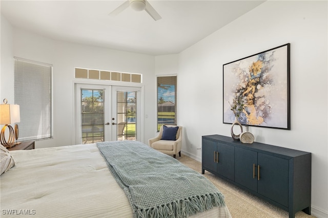 bedroom with a ceiling fan, baseboards, french doors, light carpet, and access to outside