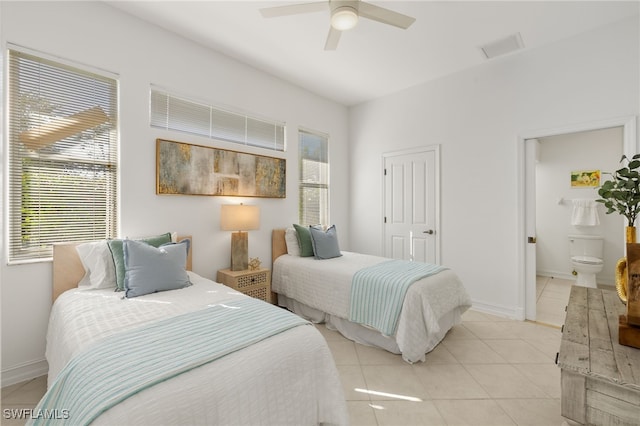 bedroom featuring multiple windows, baseboards, visible vents, and light tile patterned floors