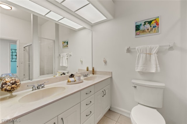 full bathroom featuring a shower stall, toilet, tile patterned floors, and a sink