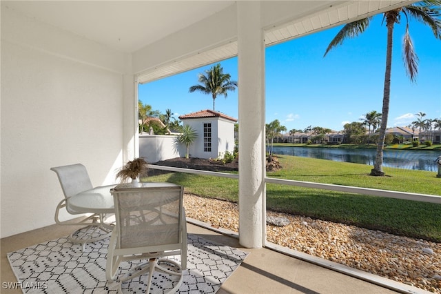 view of patio / terrace with outdoor dining space and a water view