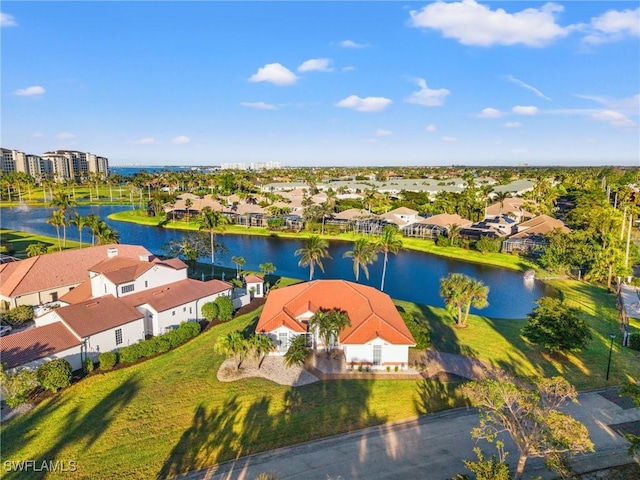 aerial view featuring a residential view and a water view