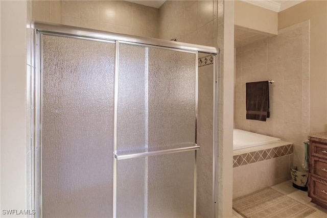 bathroom featuring vanity and a shower with shower door