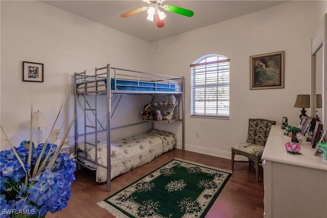 bedroom with hardwood / wood-style floors and ceiling fan