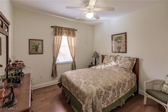 bedroom featuring ceiling fan and dark hardwood / wood-style flooring