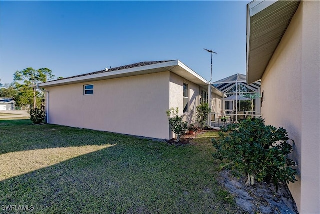 view of side of property featuring a yard