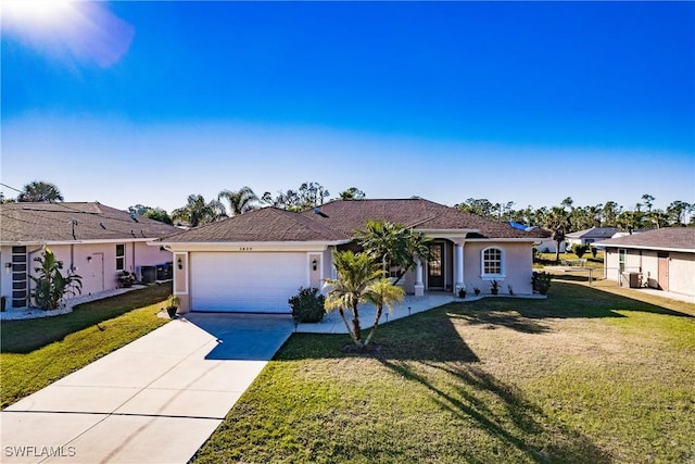 view of front of home featuring a front lawn and a garage