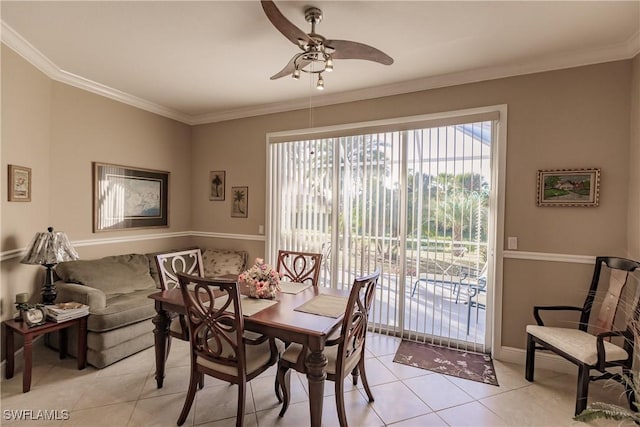 dining room with ceiling fan, light tile patterned flooring, and ornamental molding