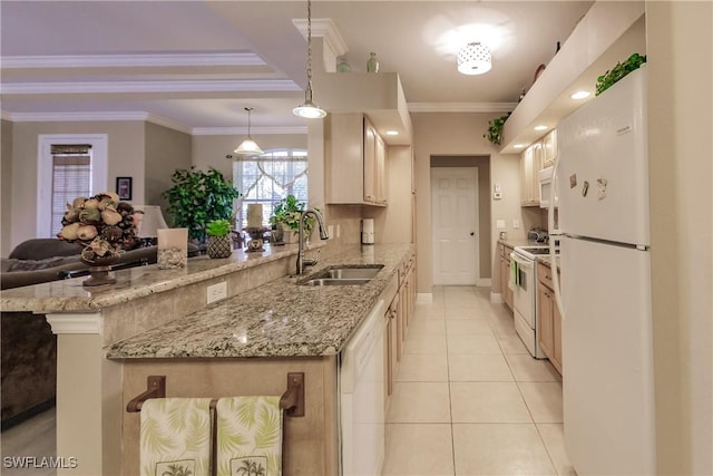 kitchen with ornamental molding, white appliances, sink, decorative light fixtures, and a breakfast bar area