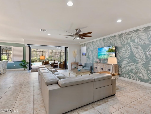 living room featuring a wealth of natural light, ceiling fan, and crown molding