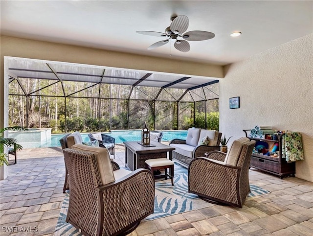 view of patio / terrace featuring outdoor lounge area, a swimming pool with hot tub, glass enclosure, and ceiling fan