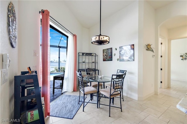 dining area with light tile patterned floors