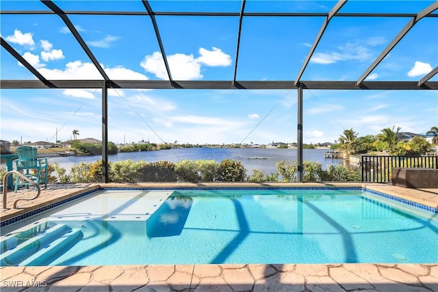 view of swimming pool with glass enclosure, a water view, and a patio