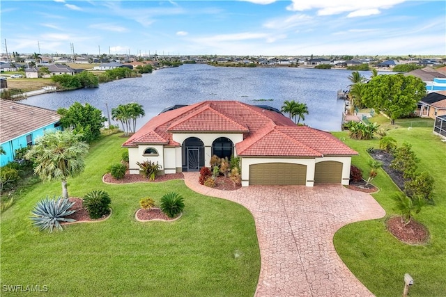 view of front of house featuring a water view and a garage