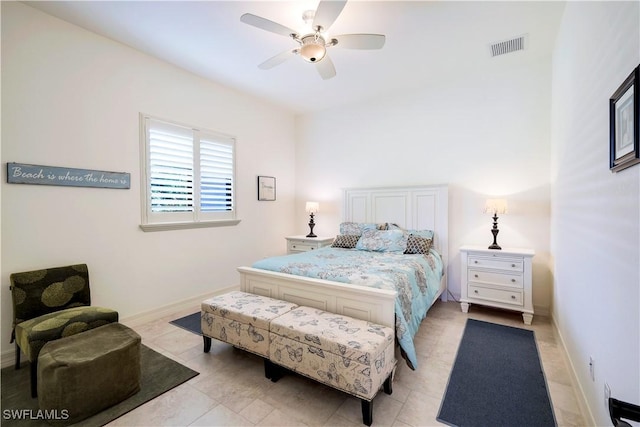 tiled bedroom featuring ceiling fan