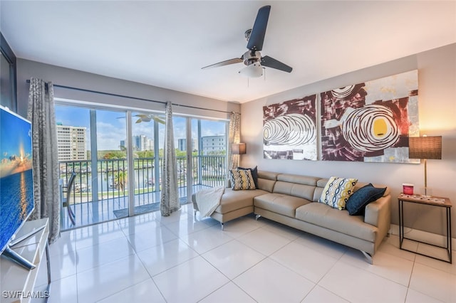 1 Bluebill Ave Unit 503, Naples, FL 34108 - living room with a city view, tile patterned flooring, and ceiling fan