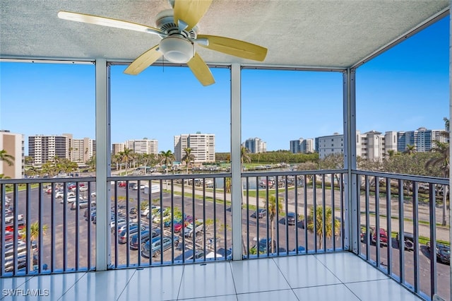 1 Bluebill Ave Unit 503, Naples, FL 34108 - balcony featuring a city view and ceiling fan