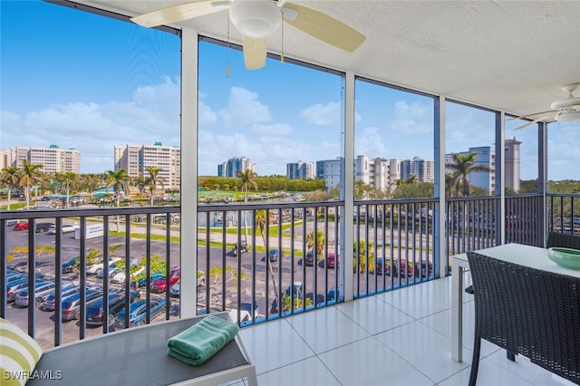 1 Bluebill Ave Unit 503, Naples, FL 34108 - balcony with ceiling fan and a view of city