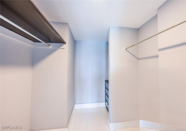 spacious closet featuring light tile patterned floors