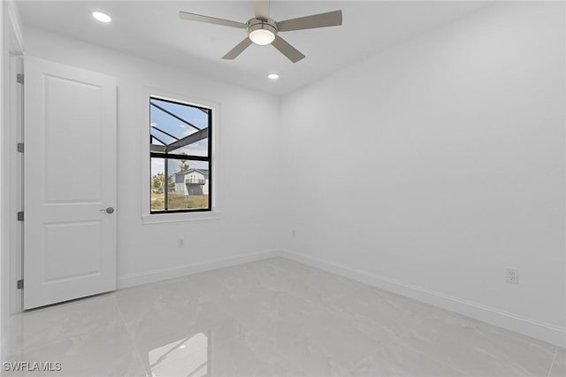 spare room with a ceiling fan, recessed lighting, and baseboards