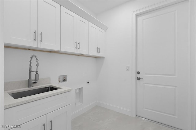 laundry room featuring baseboards, hookup for a washing machine, cabinet space, hookup for an electric dryer, and a sink