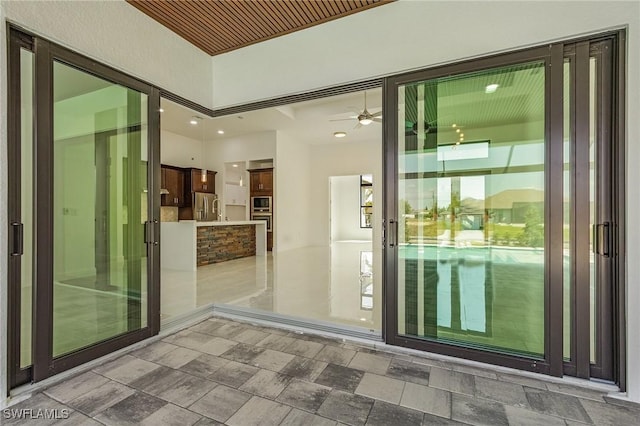 property entrance with stucco siding