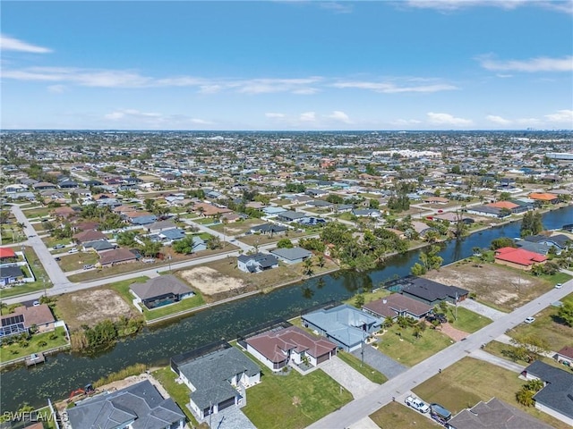 bird's eye view featuring a residential view and a water view