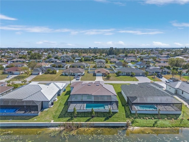 birds eye view of property featuring a residential view and a water view