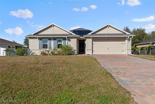 view of front facade with a garage and a front lawn