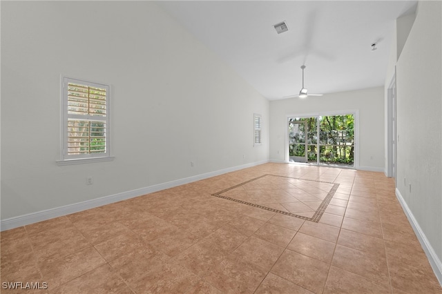 unfurnished room featuring ceiling fan, light tile patterned flooring, and high vaulted ceiling