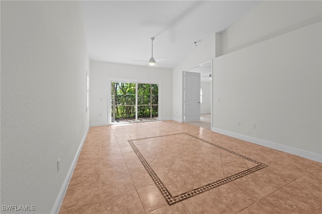 unfurnished room featuring ceiling fan, light tile patterned flooring, and lofted ceiling