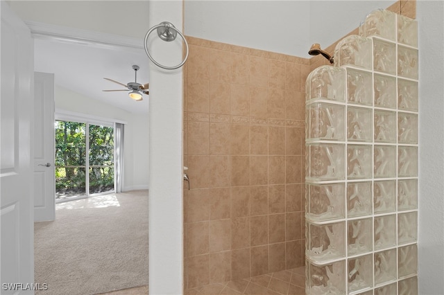 bathroom featuring ceiling fan, a shower, and lofted ceiling