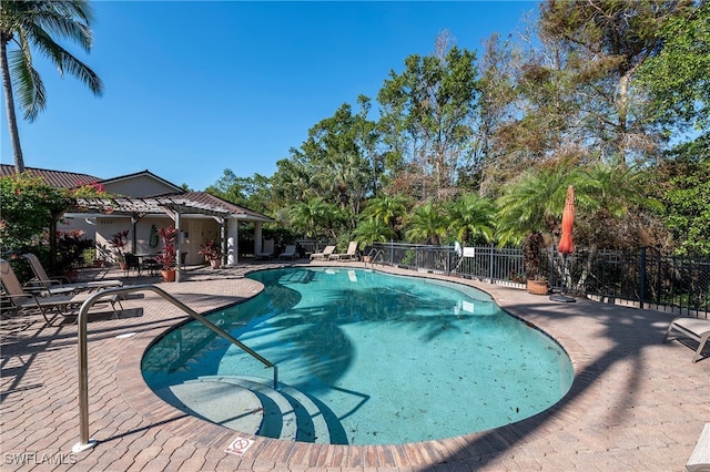 view of swimming pool featuring a patio area