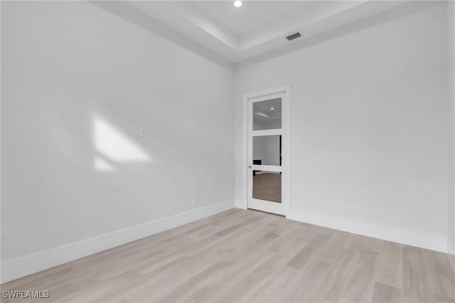 spare room with light hardwood / wood-style flooring