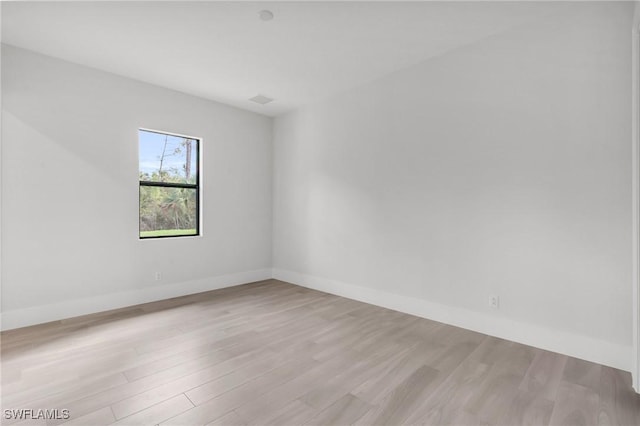 spare room featuring light hardwood / wood-style flooring