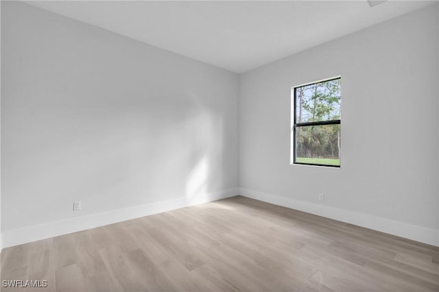 unfurnished room featuring light hardwood / wood-style flooring