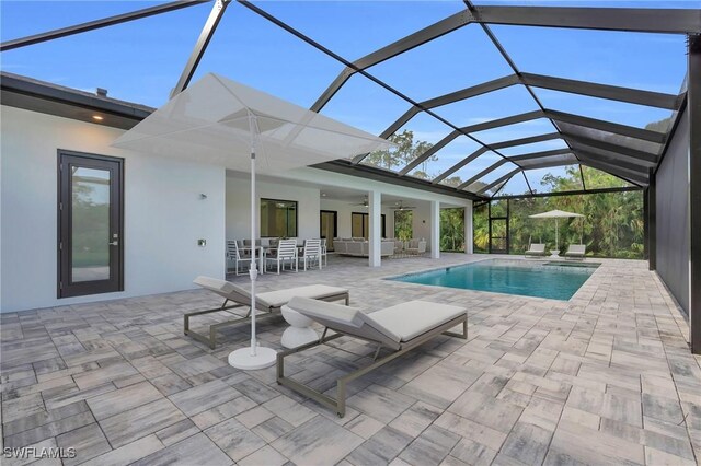 4751 1st Ave SW, Naples, FL 34119 - outdoor pool with a ceiling fan, a patio area, a lanai, and outdoor dining area