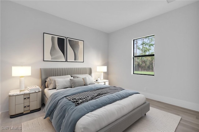 bedroom with light wood-type flooring