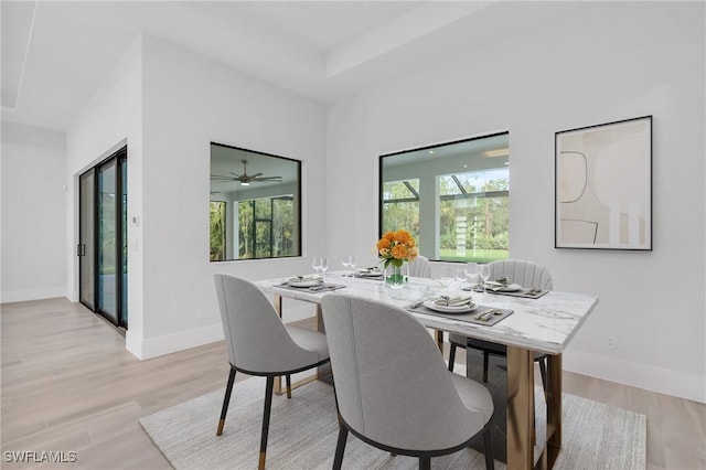 4751 1st Ave SW, Naples, FL 34119 - dining room with healthy amount of natural light, light wood finished floors, and baseboards