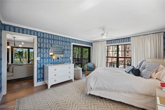 bedroom with access to exterior, hardwood / wood-style floors, ceiling fan, and crown molding