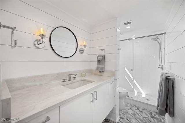 bathroom with vanity, toilet, and walk in shower