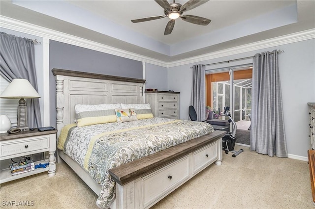 carpeted bedroom featuring a raised ceiling, access to exterior, and ceiling fan