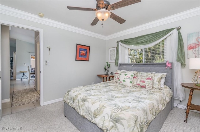 bedroom featuring ceiling fan, light colored carpet, and crown molding