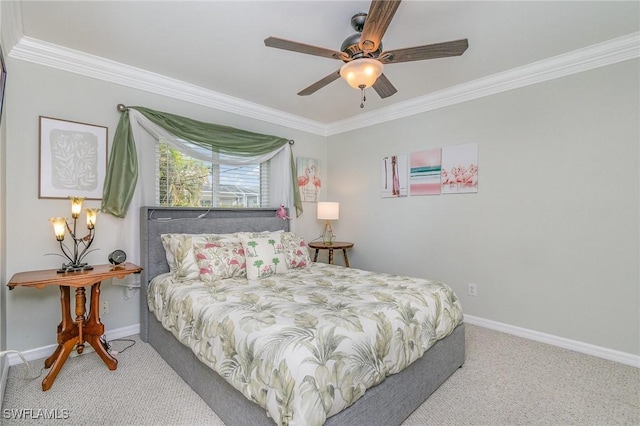 carpeted bedroom with ceiling fan and crown molding