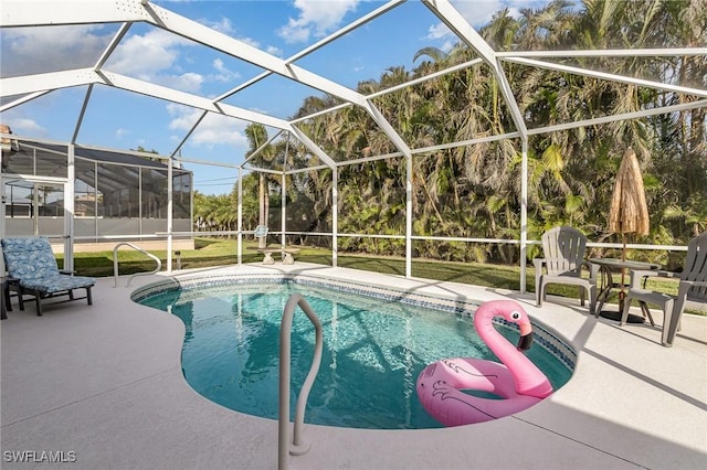 view of swimming pool with a patio and glass enclosure