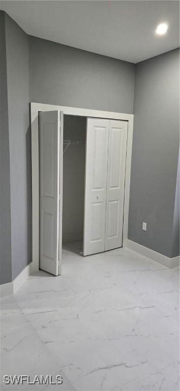 unfurnished bedroom featuring a closet