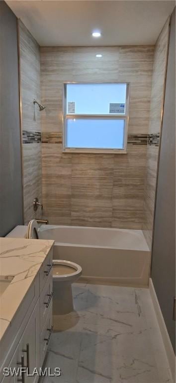 full bathroom featuring vanity, toilet, and tiled shower / bath combo