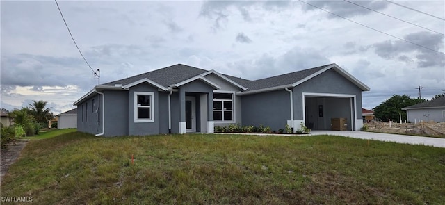 view of front of house with a garage and a front yard